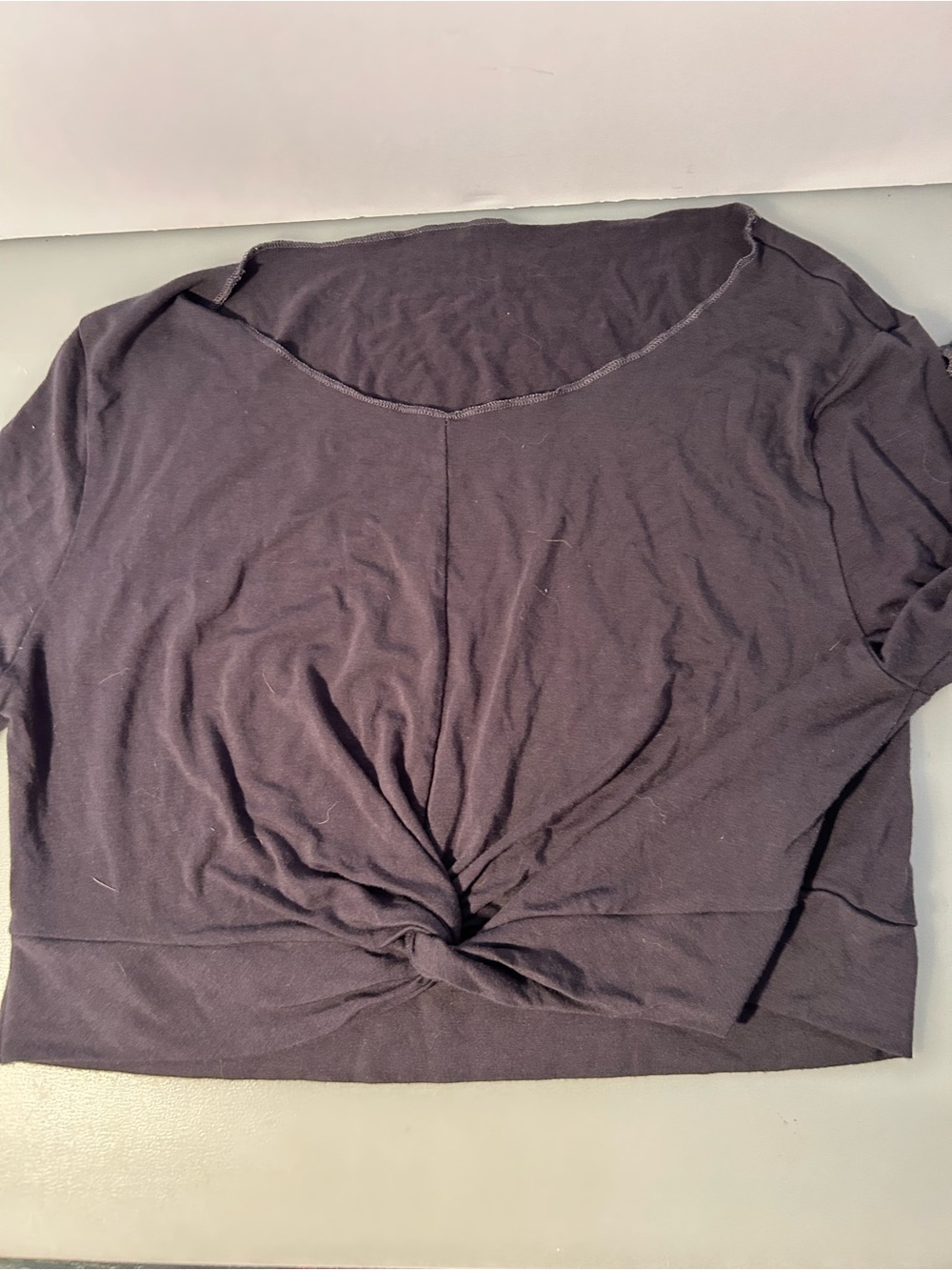 Loose fitted dark colored long sleeved tee